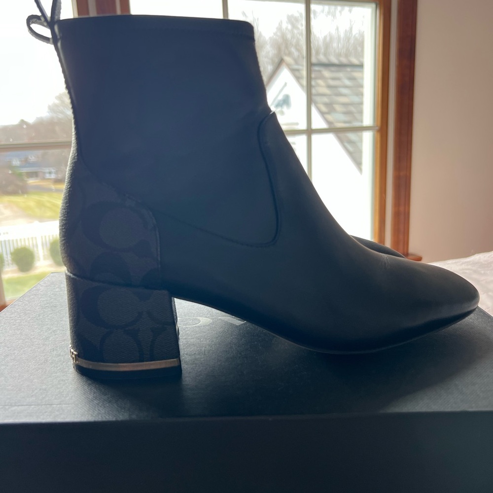 Women’s black coach boots